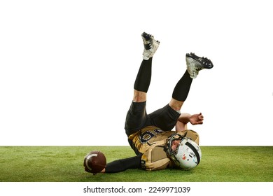 Catching ball and falling. Man, professional american football player in motion over white studio background with green grass flooring. Concept of sport, movement, achievements, competition, hobby - Powered by Shutterstock