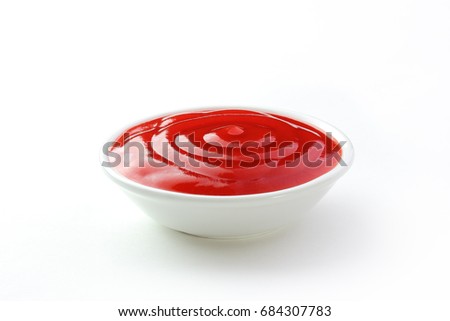 catchup in a dish isolated white background