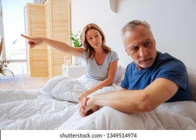 Categorical wife. Grey-haired husband not listening to his categorical emotional wife - Shutterstock ID 1349514974