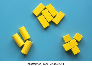 Category concept. Different shape of yellow wooden geometry block rearrange into its category. - Shutterstock ID 2250632211