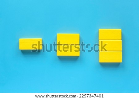 Category concept. Different shape of yellow wooden geometry block rearrange into its category.
