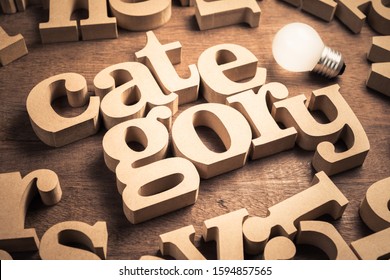 Category word in scattered English alpabets with glowing light bulb - Shutterstock ID 1594857565