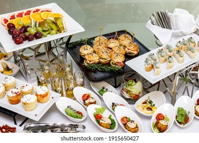 Catering Banquet Table With Different Food Snacks And Appetizers