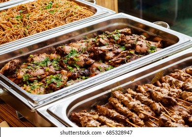 Catering Buffet Food Dish with Meat and Colorful vegetables on a Table
