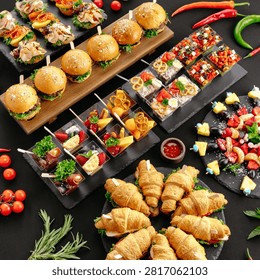 Catering buffet spread with sliders and snacks