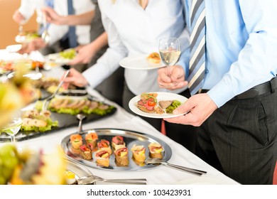 Catering At Business Company Event People Choosing Buffet Food Appetizers