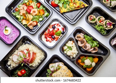 Catering food with healthy balanced diet delicious lunch box boxed take away deliver packed ready  meal in black container dinner, meal, brakfast - Shutterstock ID 1674683422