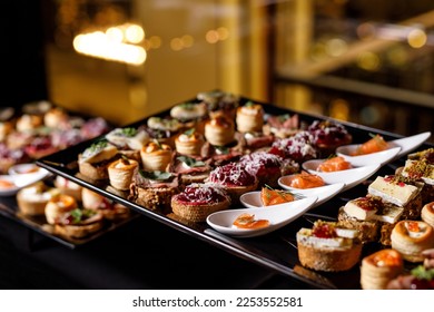 Catering plate. Assortment of snacks on the buffet table