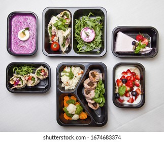 Catering restaurant take away food with healthy balanced diet delicious lunch box boxed deliver packed ready meal in black container dinner, meal, brakfast