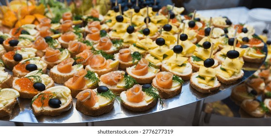Catering - served table with various snacks, canape and appetizers