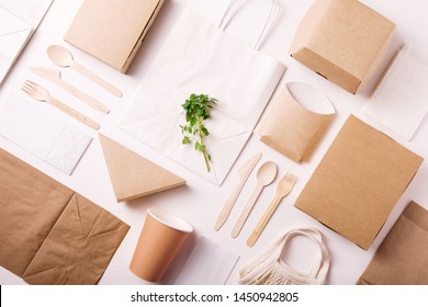 Catering And Street Fast Food Paper Cups, Plates And Containers. Eco-friendly Food Packaging On White Background With Copy Space. Flat Lay. Top View. Carering Of Nature And Recycling Concept.