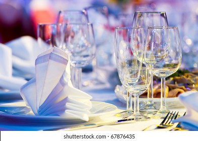 catering table set service with silverware, napkin and glass at restaurant before party - Powered by Shutterstock