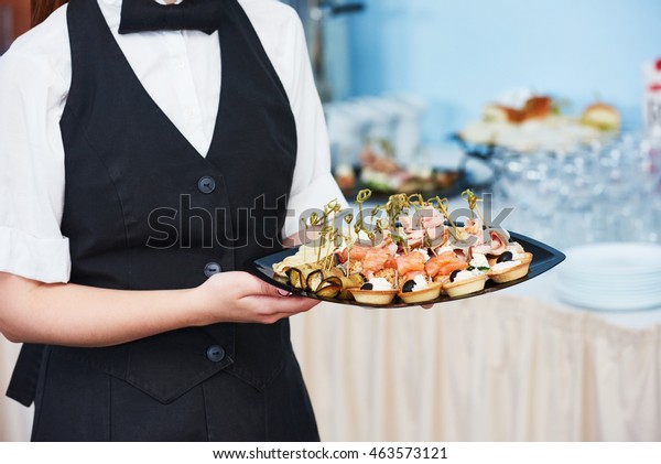 Catering\
waitress service. woman at restaurant\
event