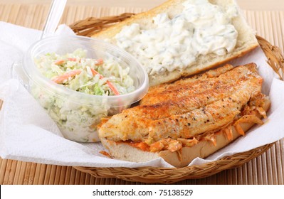 Catfish Fillet Sandwich With Coleslaw In A Basket