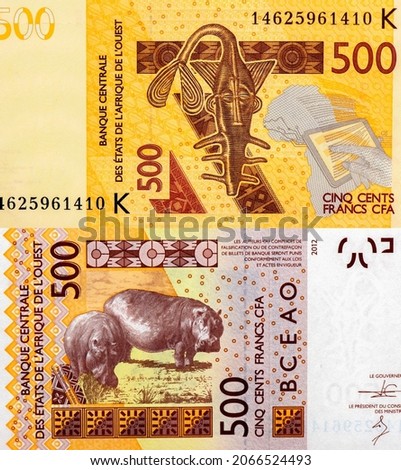 Catfish shaped brass weight of the Ashanti people for weighing gold dust, banana trees. Portrait from Western African States 500 Francs 2003 Banknotes. CFA franc is used in 14 African countries. 