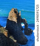 Cathederal Rock, a stone formation in the sea with an arch