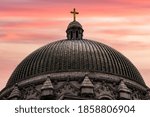 Cathedral Basilica of Saint Louis building dome at sunset.