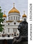 Cathedral of Christ the Savior with golden domes and a black bronze lion
