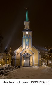 Tromsø Cathedral With Falling Snow By Night.