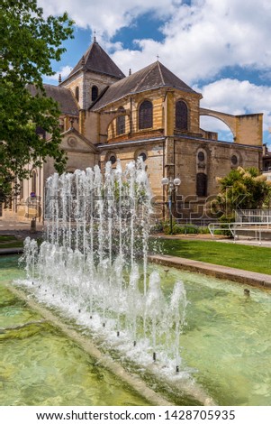 Cathedral Notre Dame in Dax town, as seen from the park, the fountain is at foreground. Southwestern France, Landes, Nouvelle Aquitaine.