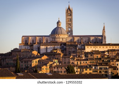 Cathedral In The Old Town Of Medieval Siena At Sunset.