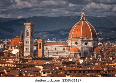 The Cathedral of Santa Maria del Fiore and the Giotto's Bell Tower hidden by some trees