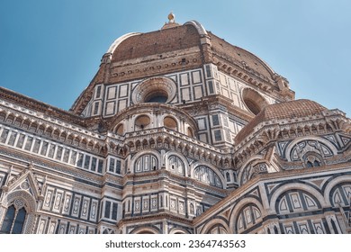 Cathedral of Santa Maria del Fiore, Brunelleschi's dome in Florence with blue sky                