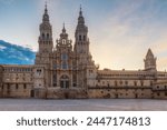 Cathedral of Santiago de Compostela at sunrise from main square Praza do Obradoiro, Galicia, Spain. Facade of famous Galician gothic church. Popular touristic landmark with nobody