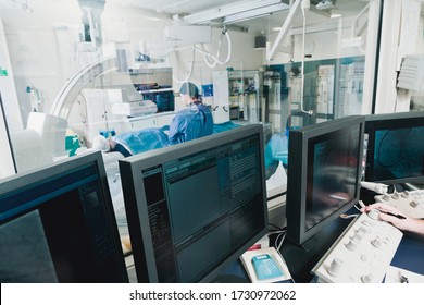 Cathlab in modern hospital with doctor, nurse and patient