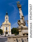 The Catholic church and the Holy Trinity Column in the King Bela street of Szekszard, Hungary