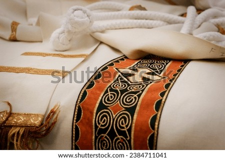 Catholic church priest chasubles, vestments, traditional robes, priest's religious clothing, clothes simple concept, detail, extreme closeup, nobody.