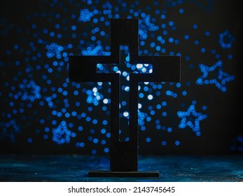 Catholic cross on a blue background with stars. Religion, catholicism, spirituality, faith, jesus christ, crucifixion, spiritual communion. There are no people in the photo. Banner.