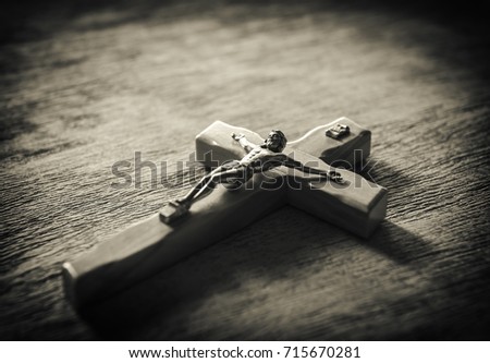  Catholic cross on a wooden background with free space for text
