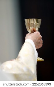 Catholic mass. Priest at eucharistic celebration. France. - Shutterstock ID 2252863393