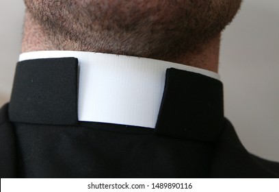 Catholic priest with collar around the neck