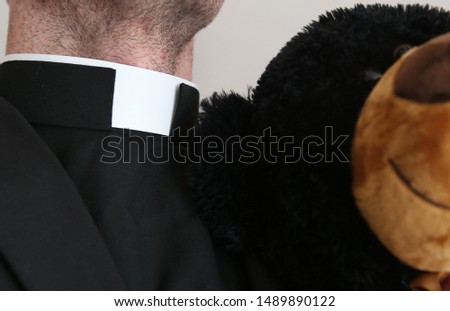 Catholic priest with collar around the neck