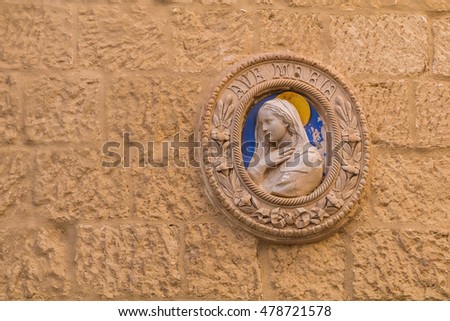 Catholic religious plaque on limestone wall, Mdina, Malta