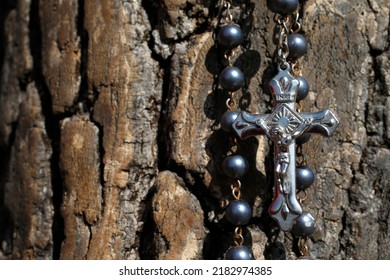 Catholic Rosary Beads On The Trunk Of A Tree.  Masai Mara. Kenya. 