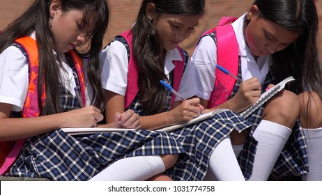 Catholic School Children Writing Wearing School Uniforms