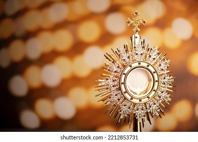 Catholic theme. Golden monstrance on bokeh background. - Powered by Shutterstock