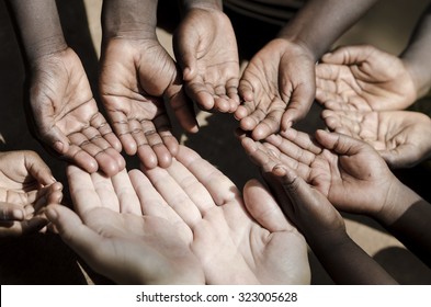 Caucasian and African Ethnicity Hands Asking for Help Symbol