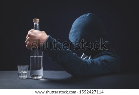 Caucasian alcoholic man with vodka.