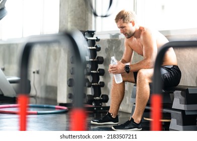 Caucasian Athlete Man Person Drink A Bottle Of Fresh Water After Workout In Sport Gym, Adult Male Exercise In Fitness For Building Strong Body, Take A Break Of Muscular Healthy Training Lifestyle