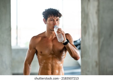 Caucasian Athlete Man Person Drink A Bottle Of Fresh Water After Workout In Sport Gym, Adult Male Exercise In Fitness For Building Strong Body, Take A Break Of Muscular Healthy Training Lifestyle