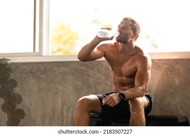 Caucasian Athlete Man Person Drink A Bottle Of Fresh Water After Workout In Sport Gym, Adult Male Exercise In Fitness For Building Strong Body, Take A Break Of Muscular Healthy Training Lifestyle