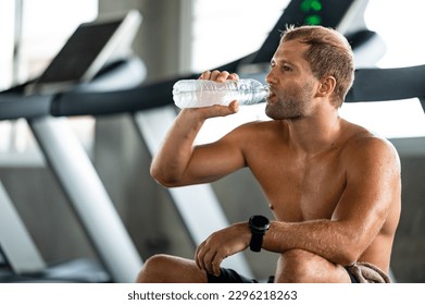 Premium Photo  Man fitness and drinking water bottle for