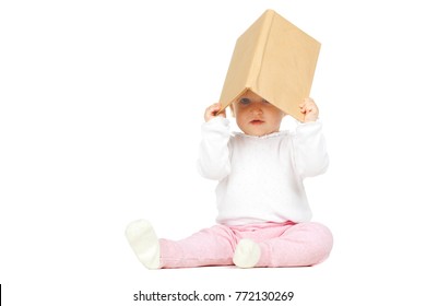 Caucasian Baby Girl Holding A Book Isolated On White Background