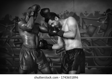 Caucasian Boxer Making Hook To African American Boxer Who Lose Guard Block In Boxing Fight Match On Stage, Selective Focused