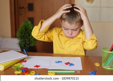 Caucasian boy with difficulty learning lessons, stress, exhausting overwork, fatigue, exhaustion, madness. Exhausted and tired student concept. Home schooling