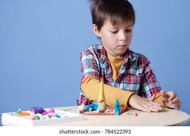 Caucasian Boy Diligently Crafting Colorful Modelling Stock Photo ...